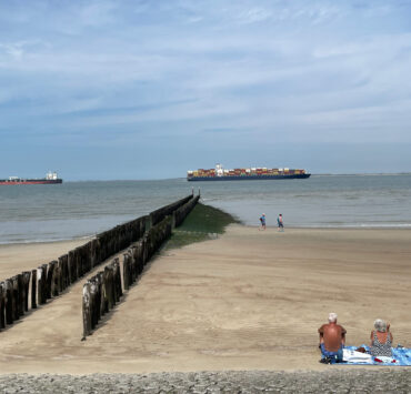 Old people sunbathing on a beach in Breskens, Zeeland