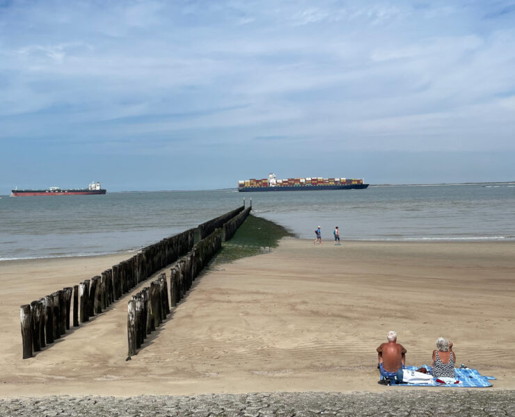 Old people sunbathing on a beach in Breskens, Zeeland