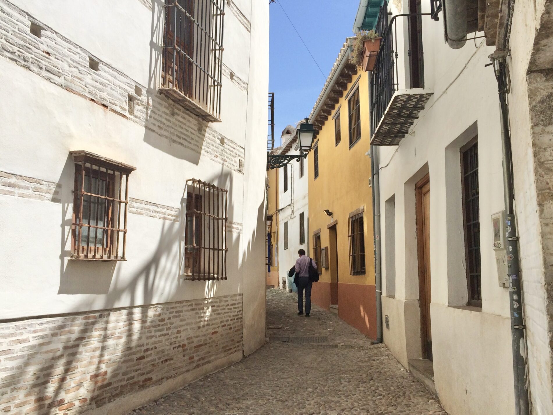 A man walks on an empty street. scaled e1630519105199