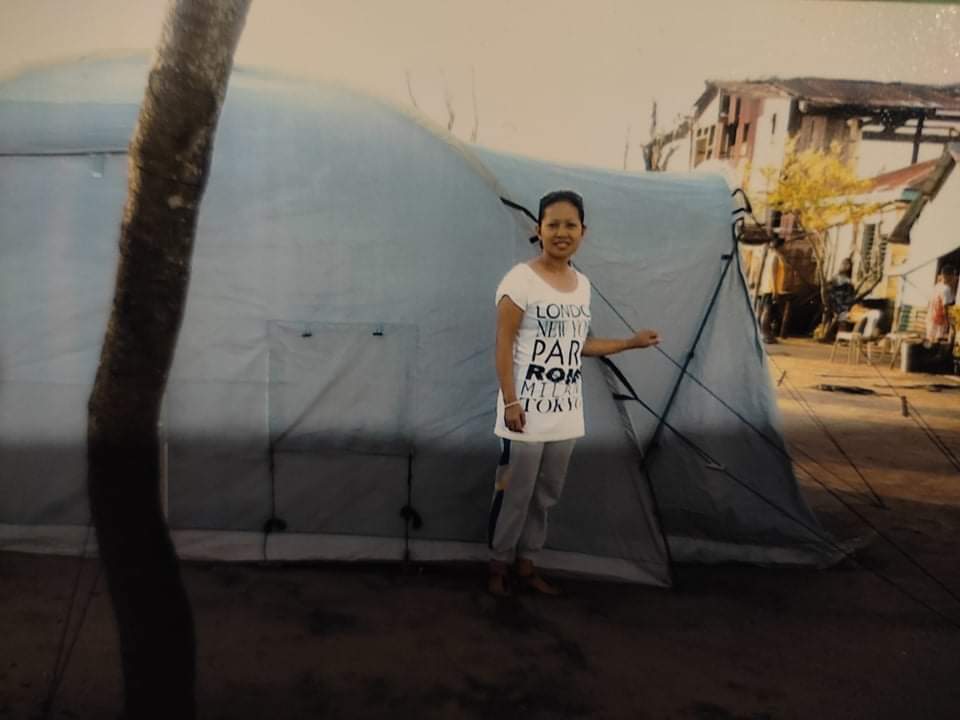 An OFW at an evacuation centre at the aftermath of typhoon Yolanda in the Philippines.