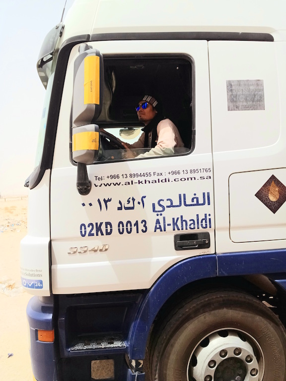 Filipino truck driver in desert of Saudi Arabia.