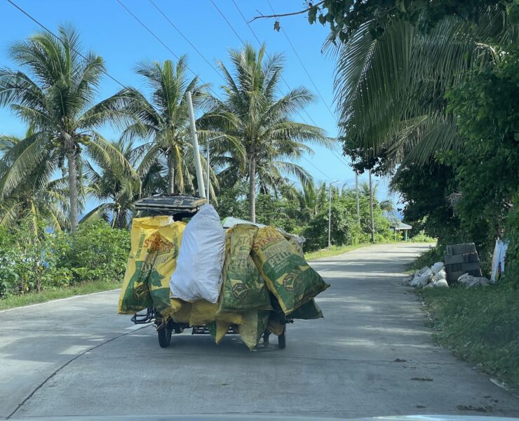 A tricycle drives into a provincial road in rural Philippines. Photo DM Aguilar