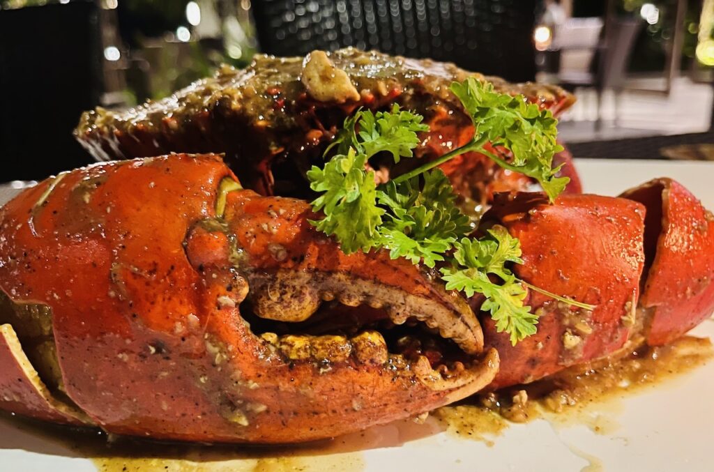 King crab and cocktails on Siargao Island, Philippines.